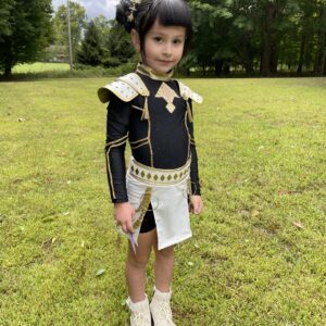 A Portrait of a little girl wearing a Kpop Demon Hunters Zoey costume